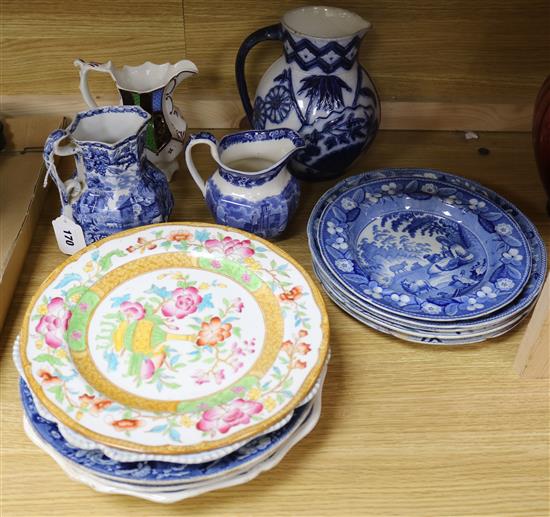 A collection of blue and white pearlware and other plates and jugs